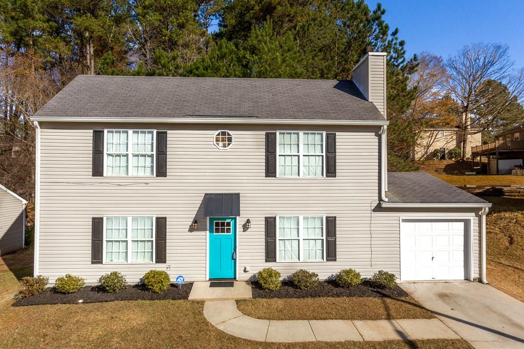 2384 Whites Ridge Decatur, GA 30034 - Photo 1 of 1 a front view of a house with a yard and garage