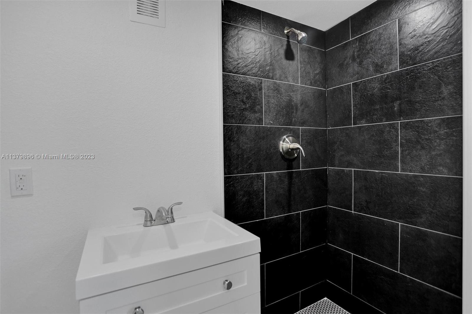 6842 Northwest 13th Street Plantation, FL 33313 - Photo 17 of 33 a bathroom with a sink toilet and shower
