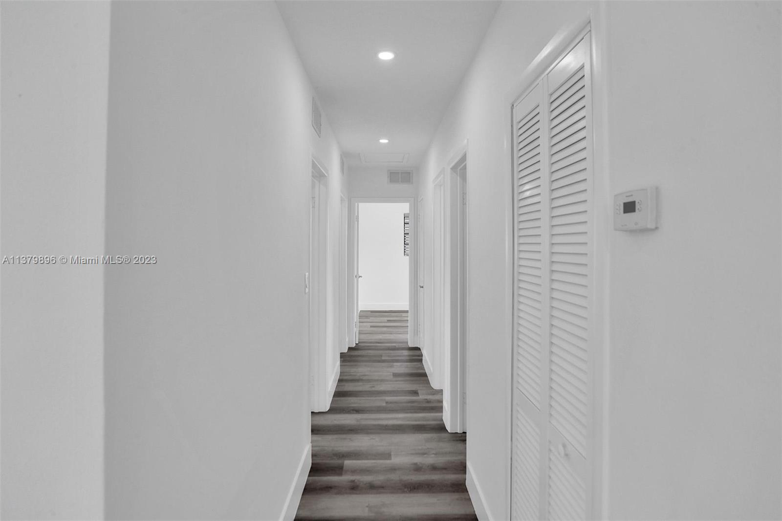 6842 Northwest 13th Street Plantation, FL 33313 - Photo 19 of 33 a view of a hallway with wooden floor and entryway