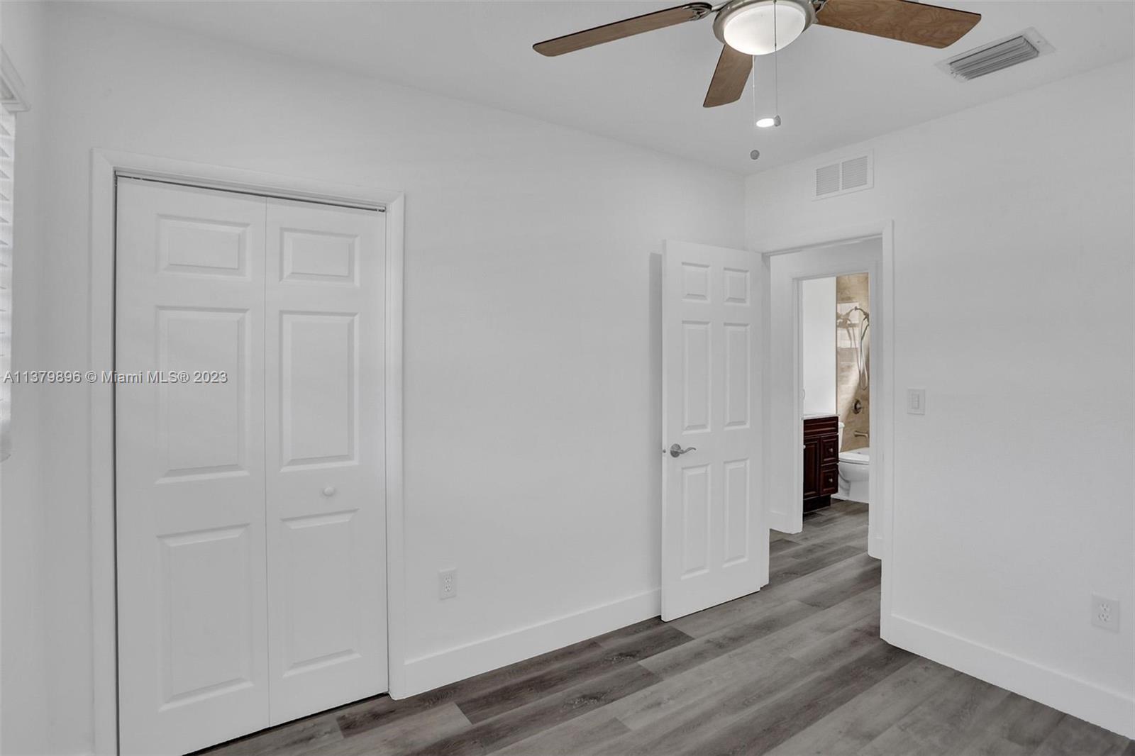 6842 Northwest 13th Street Plantation, FL 33313 - Photo 23 of 33 wooden floor in an empty room