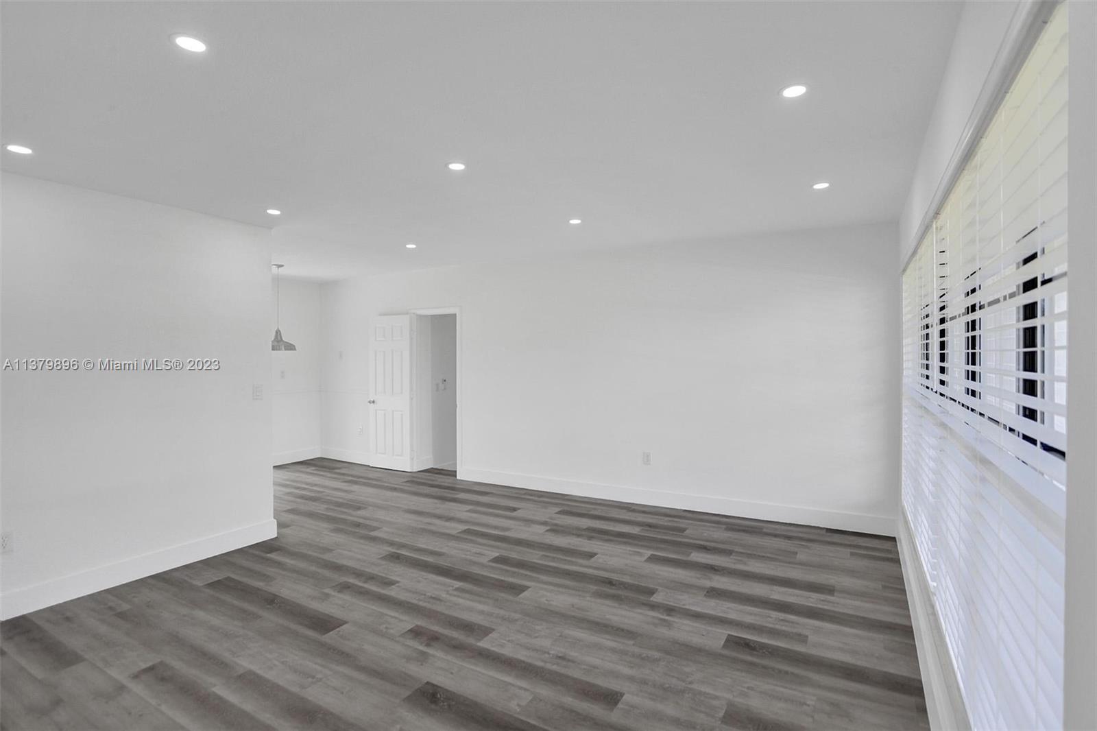 6842 Northwest 13th Street Plantation, FL 33313 - Photo 3 of 33 a view of an empty room with wooden floor