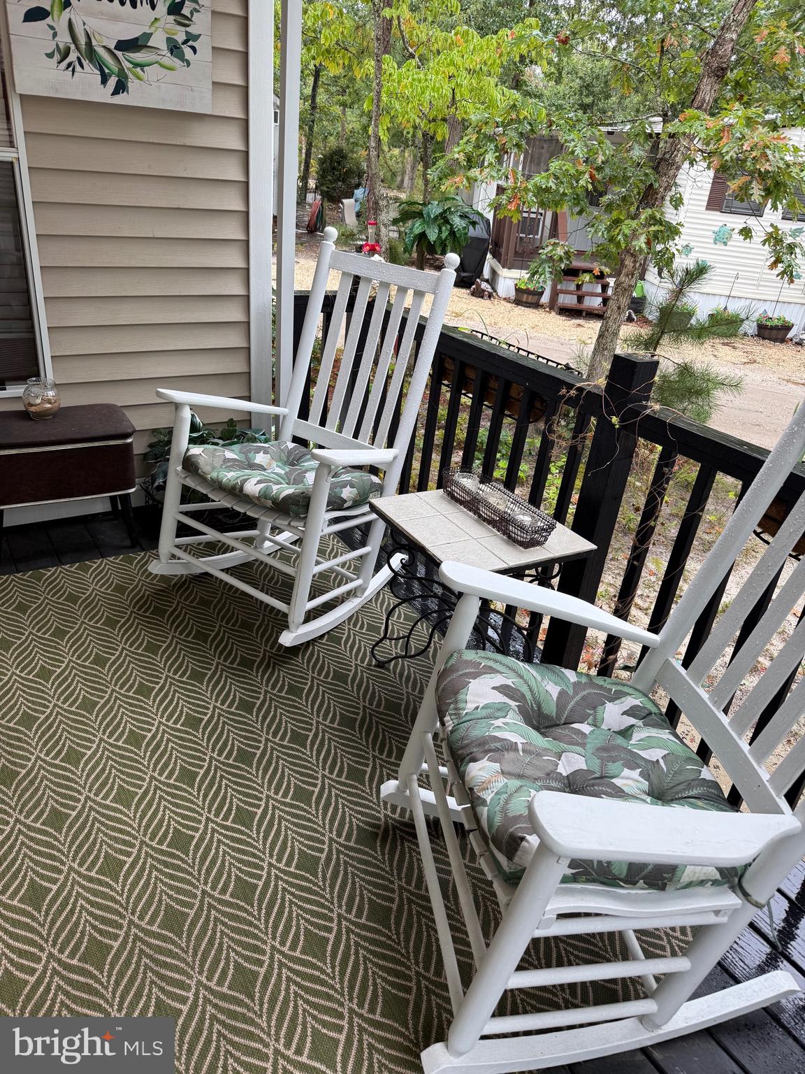 60 Corsons Tavern Road, Unit 148 Ocean View, NJ 08230 - Photo 2 of 11 a view of a balcony with chairs