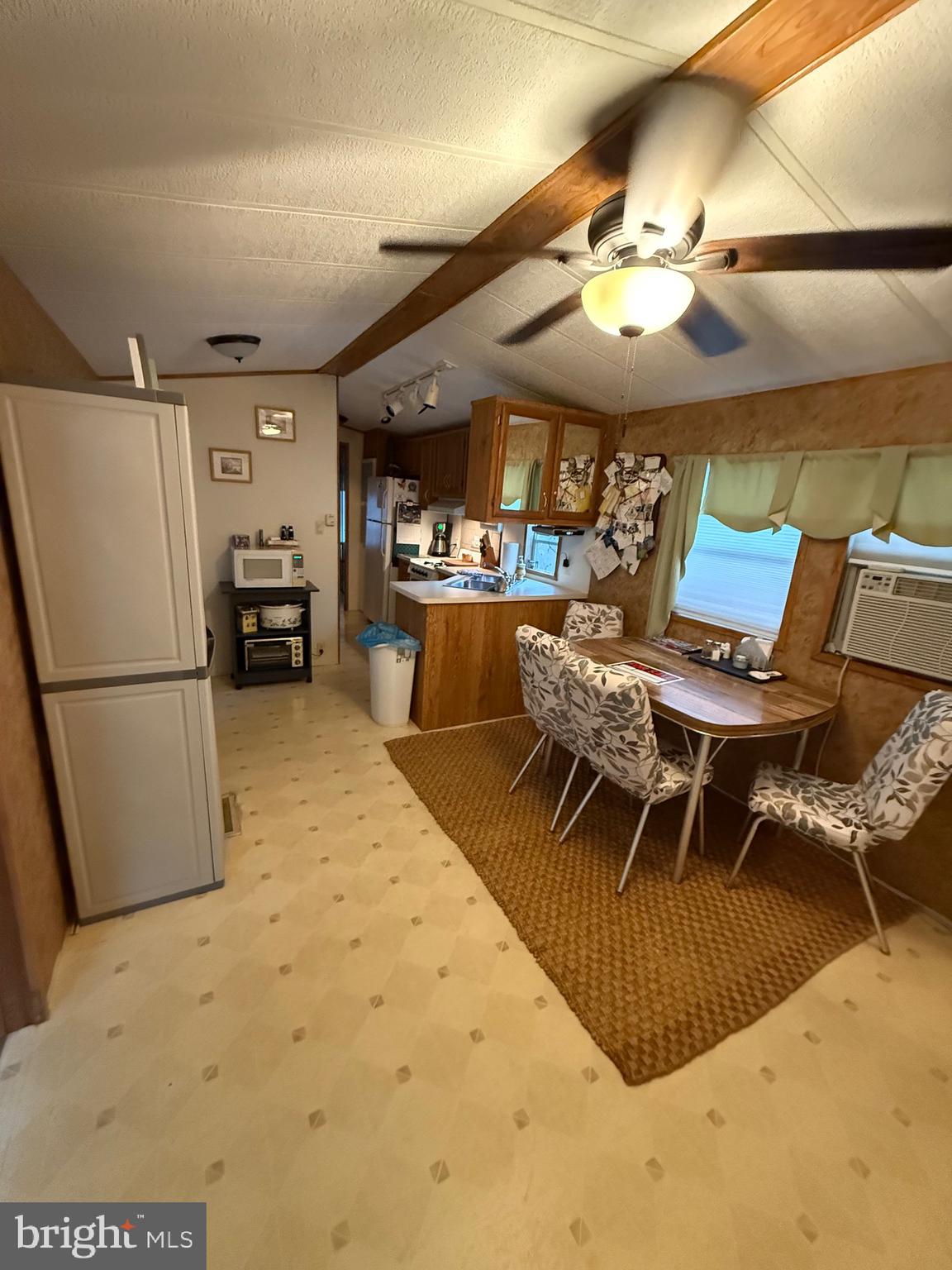 60 Corsons Tavern Road, Unit 148 Ocean View, NJ 08230 - Photo 3 of 11 a view of a dining room with furniture