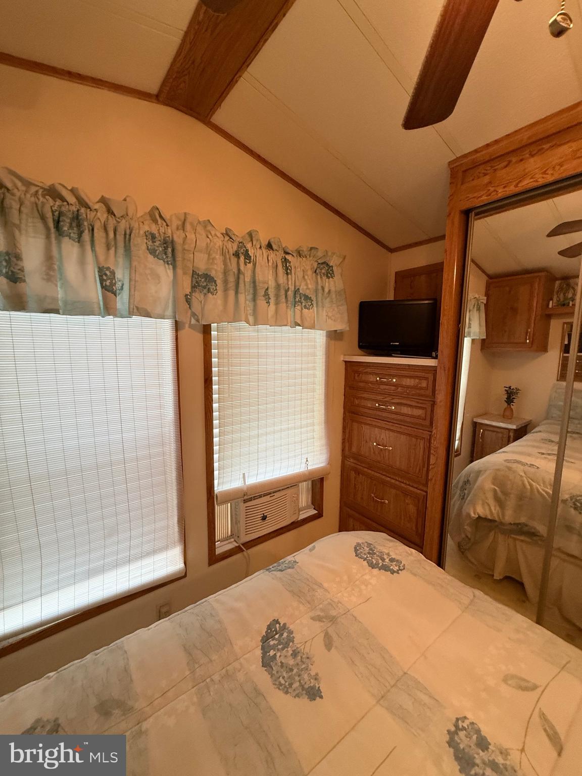 60 Corsons Tavern Road, Unit 148 Ocean View, NJ 08230 - Photo 7 of 11 a bedroom with a bed and a dresser