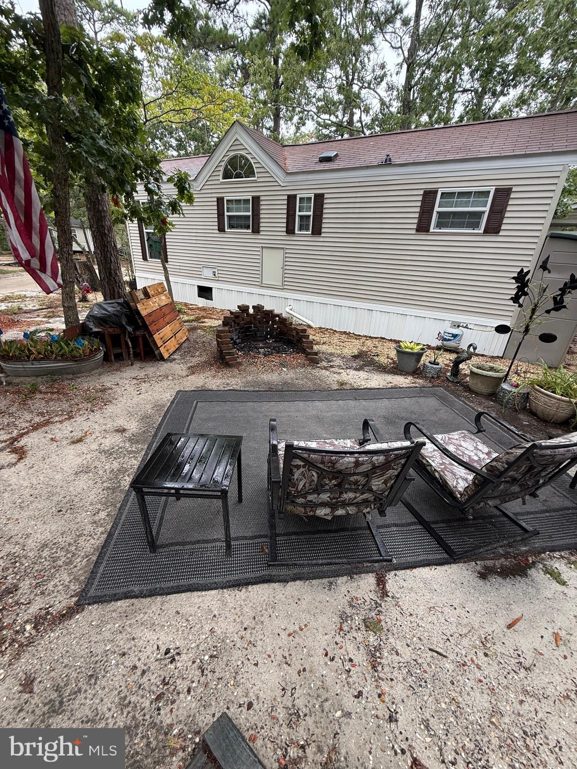 60 Corsons Tavern Road, Unit 148 Ocean View, NJ 08230 - Photo 9 of 11 a view of a yard and front view of a house