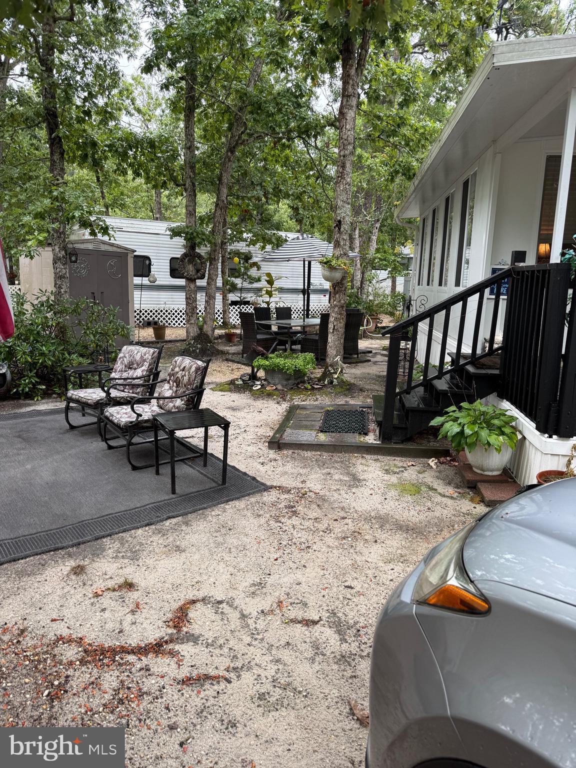 60 Corsons Tavern Road, Unit 148 Ocean View, NJ 08230 - Photo 10 of 11 a view of a backyard with sitting area