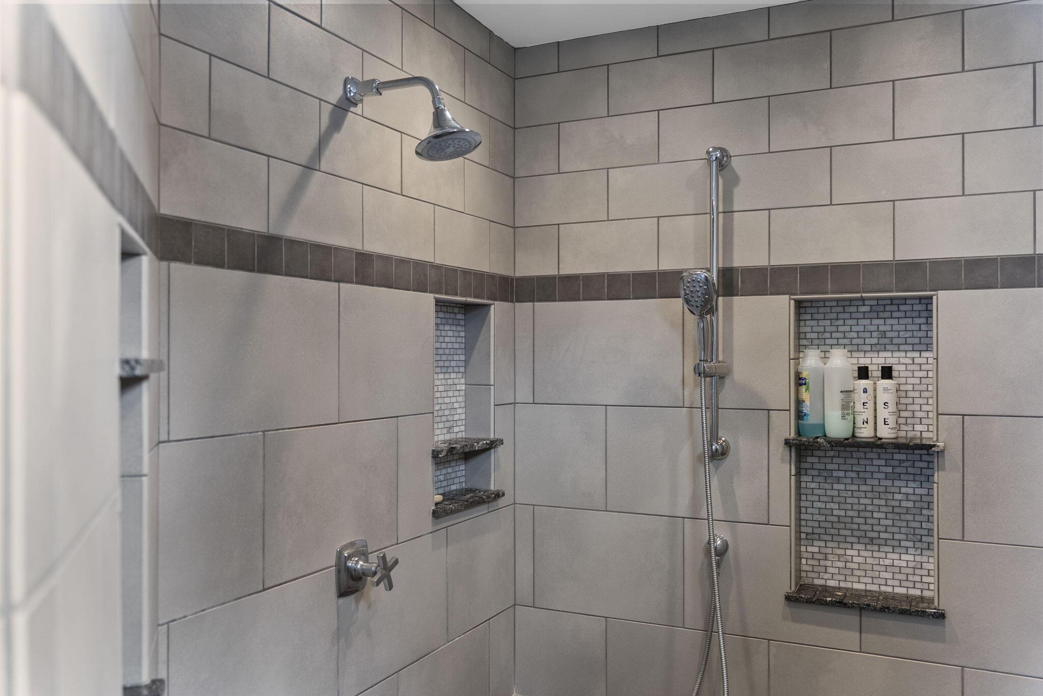 1851 Berkshire Road Columbus, OH 43221 - Photo 39 of 125 Walk-in shower with plenty of storage and sitting bench.