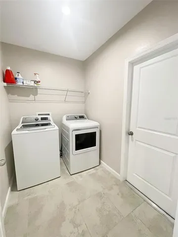 a utility room with washer and dryer