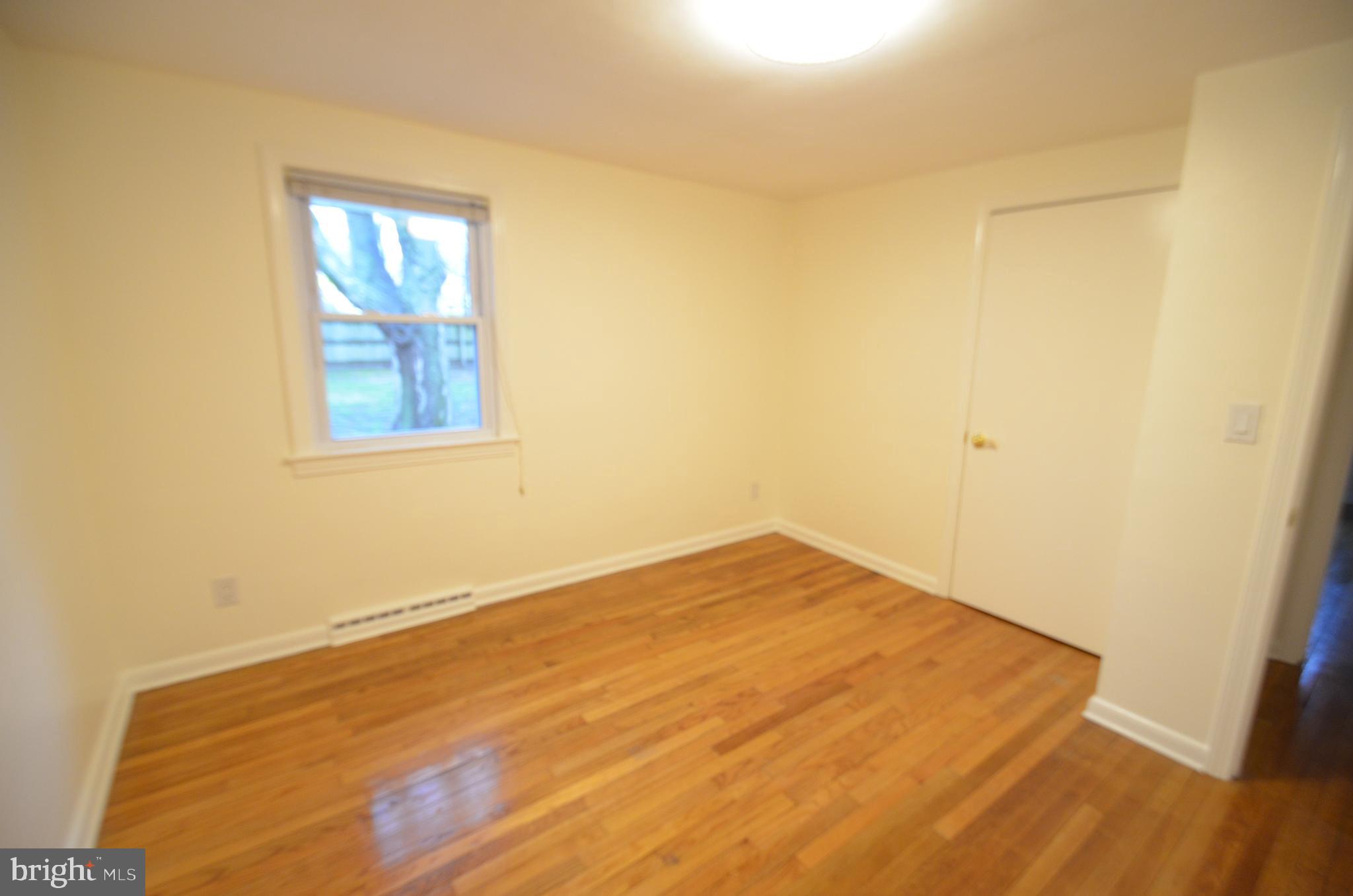 49 Wallace Road Princeton Junction, NJ 08550 - Photo 11 of 32 a view of empty room with wooden floor