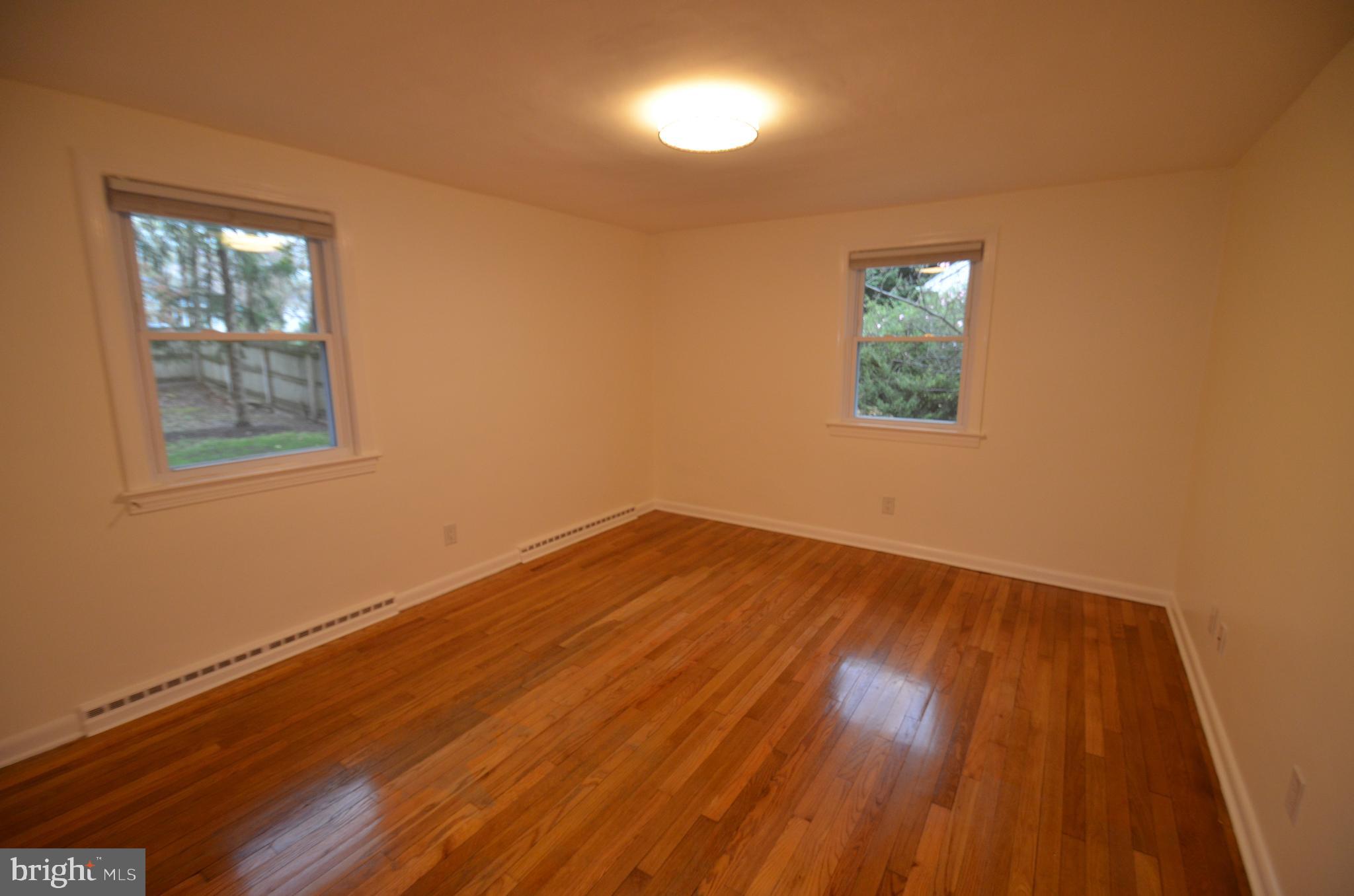 49 Wallace Road Princeton Junction, NJ 08550 - Photo 12 of 32 a view of empty room with wooden floor and fan