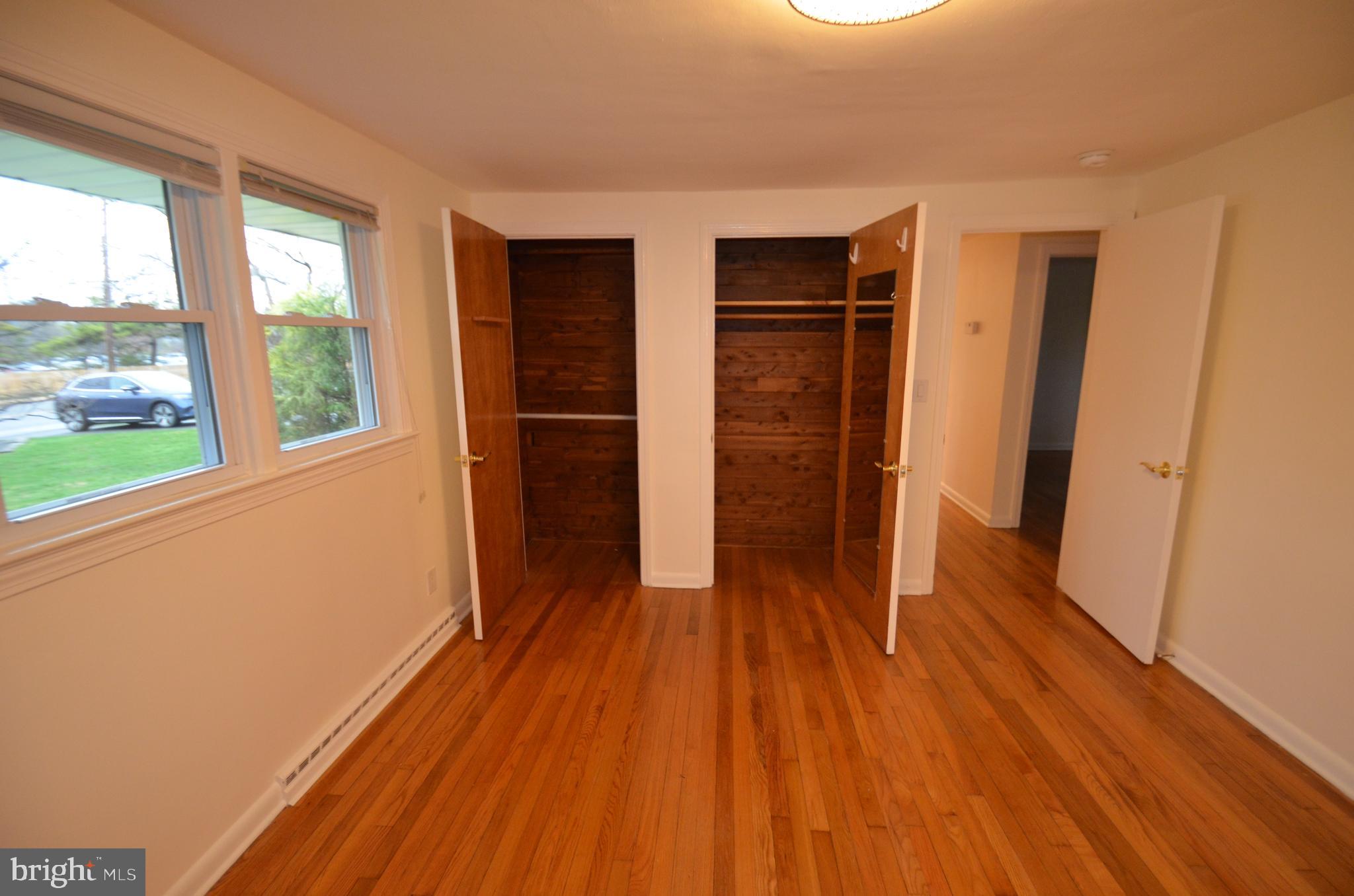 49 Wallace Road Princeton Junction, NJ 08550 - Photo 14 of 32 a view of empty room with wooden floor and fan