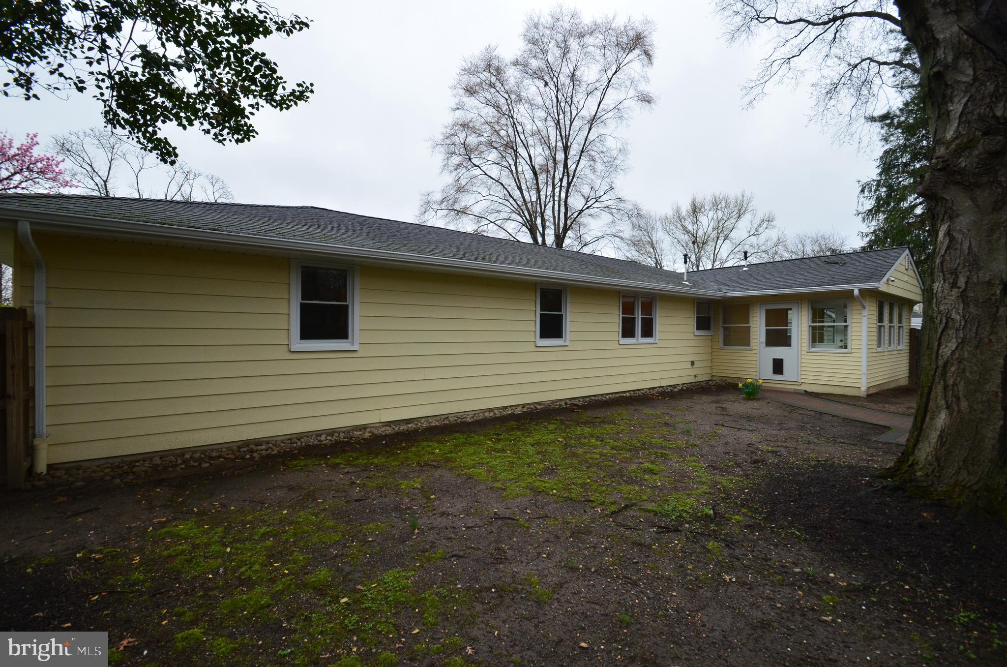 49 Wallace Road Princeton Junction, NJ 08550 - Photo 18 of 32 a view of a house with a backyard