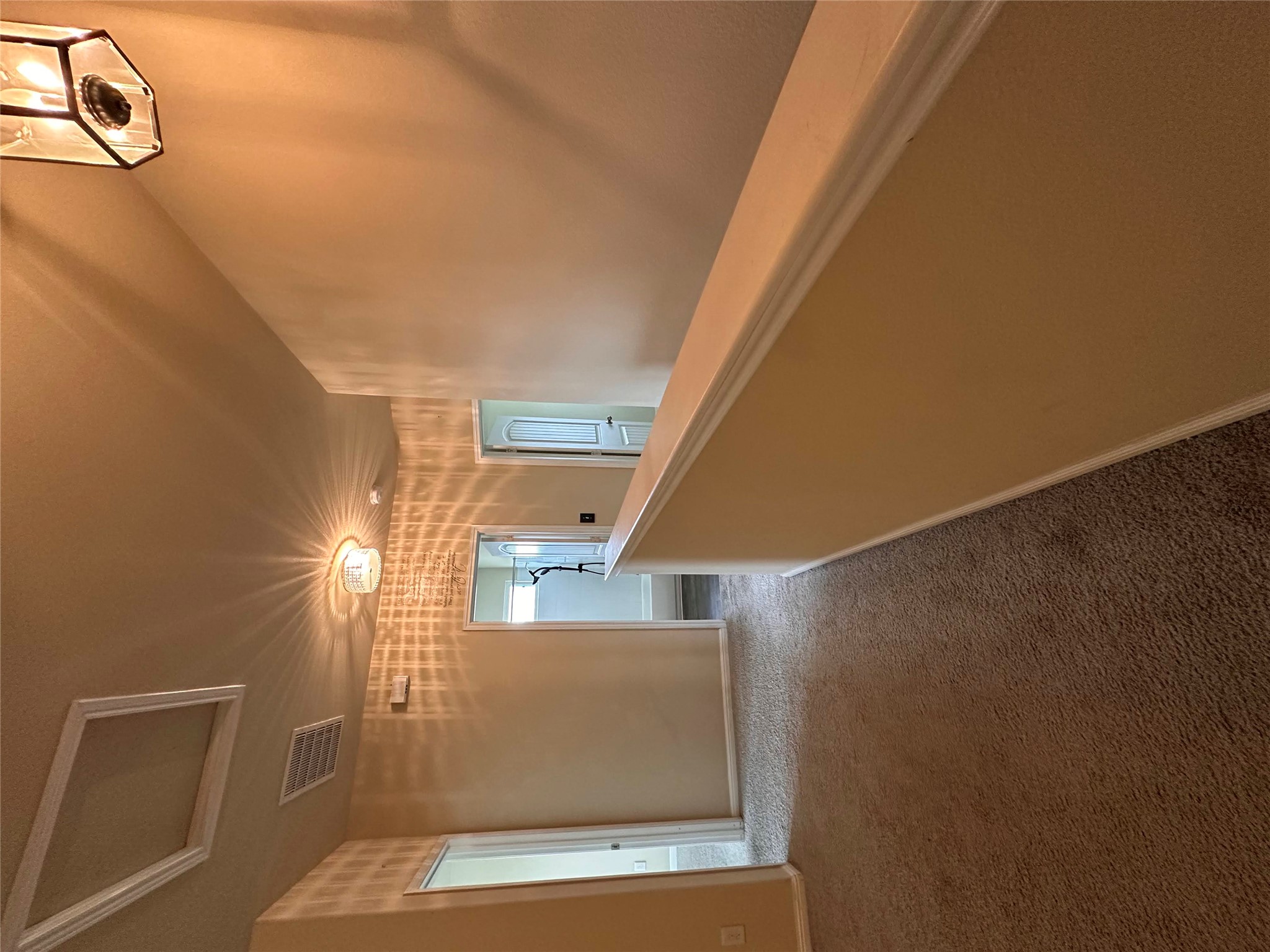 207 Liard River Road Hutto, TX 78634 - Photo 12 of 25 Hall featuring attic access and carpet floors