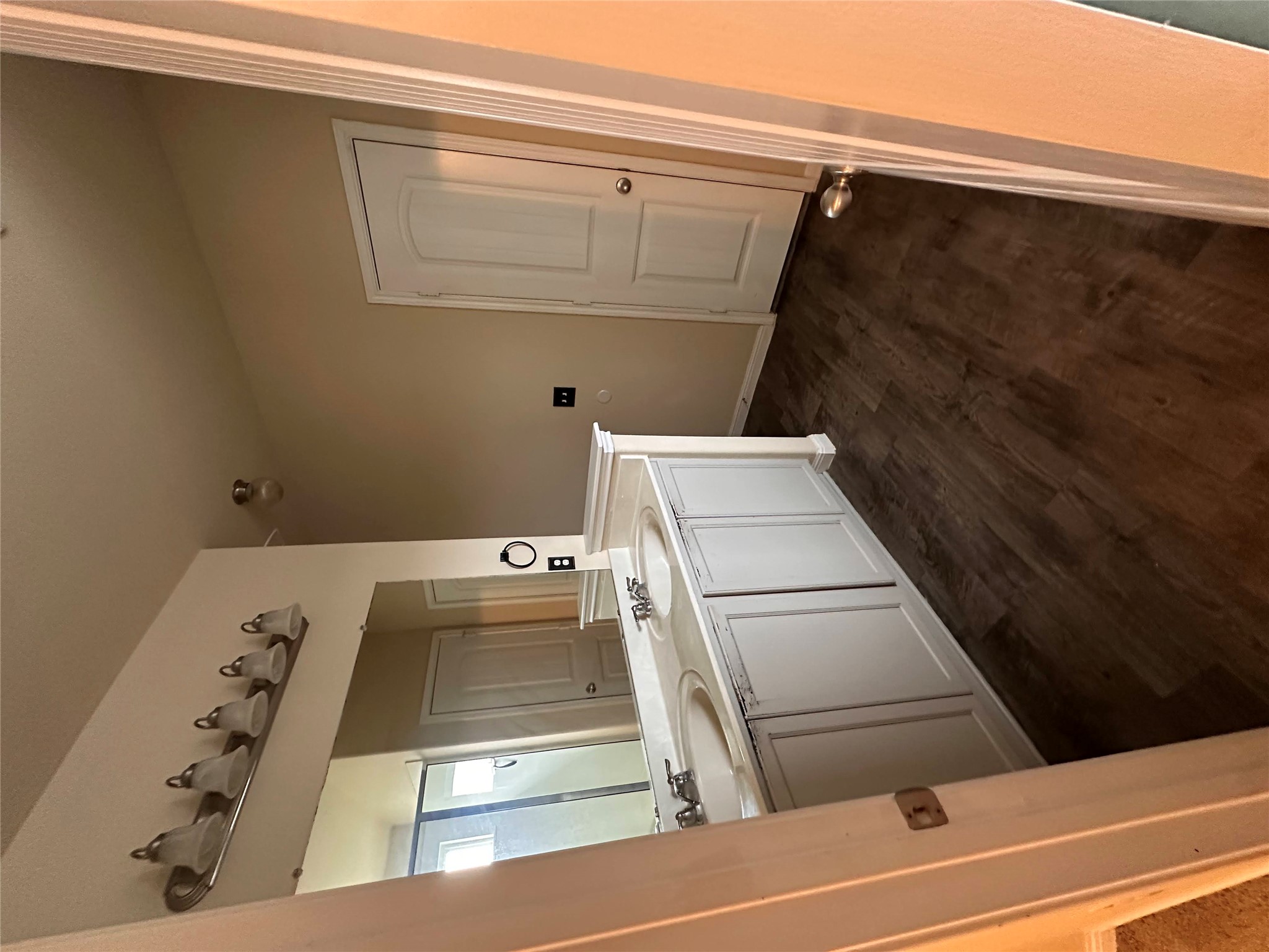 207 Liard River Road Hutto, TX 78634 - Photo 18 of 25 Full bath with double vanity and dark wood-type flooring