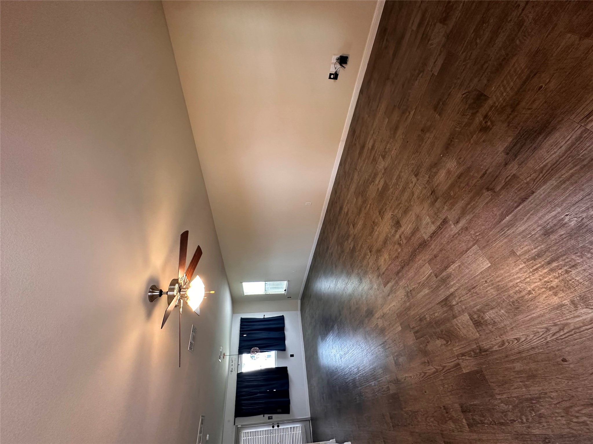 207 Liard River Road Hutto, TX 78634 - Photo 4 of 25 Unfurnished living room with ceiling fan and dark wood finished floors