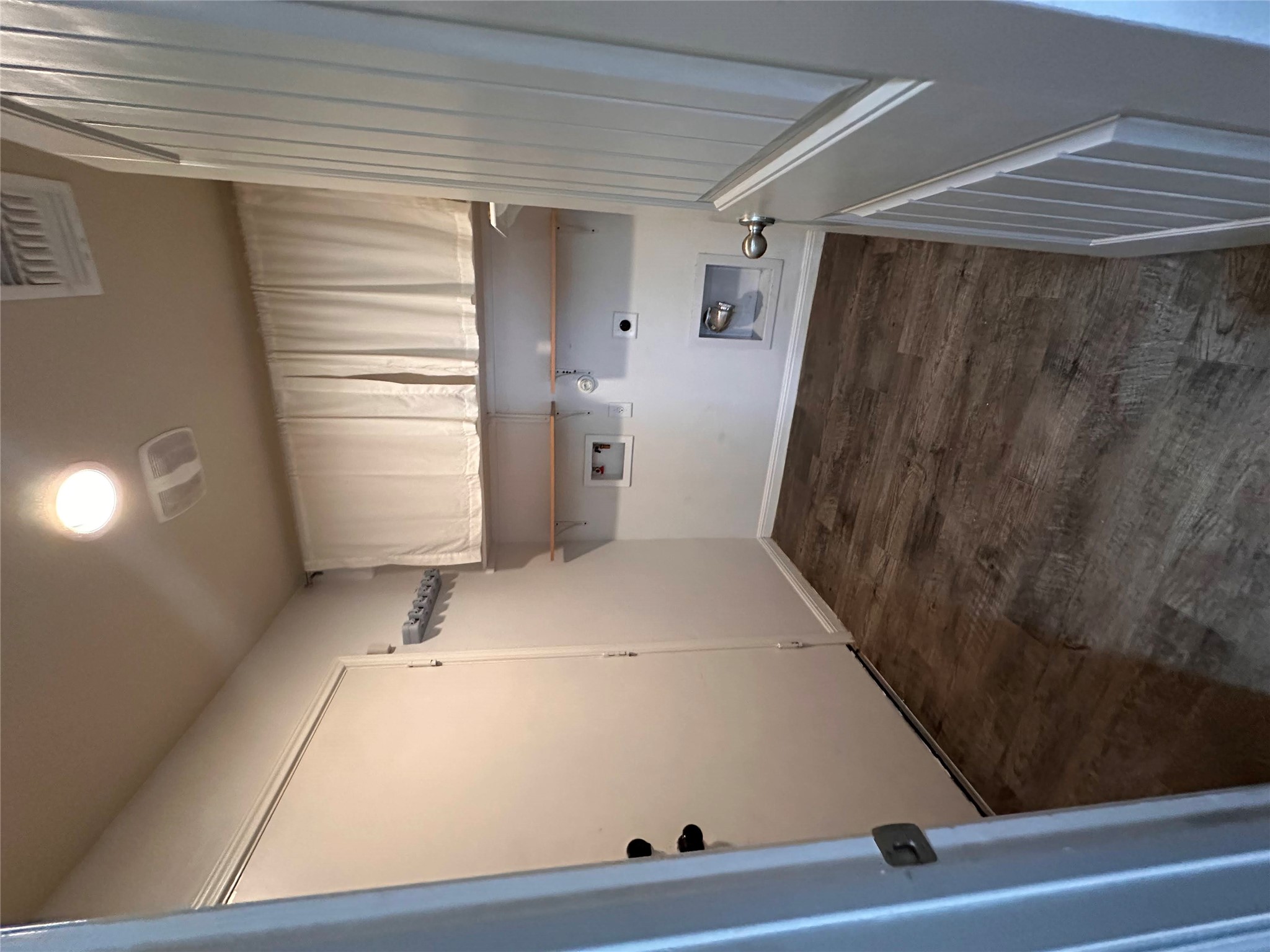 207 Liard River Road Hutto, TX 78634 - Photo 10 of 25 Laundry room with gas dryer hookup, washer hookup, dark wood finished floors, and hookup for an electric dryer