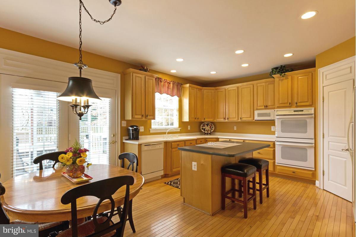 8511 Springway Road Ellicott City, MD 21043 - Photo 7 of 30 Center Island Kitchen downdraft cooktop
