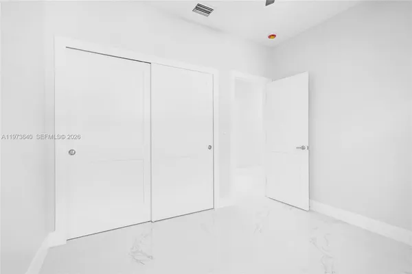 a bathroom with a bathtub and a window