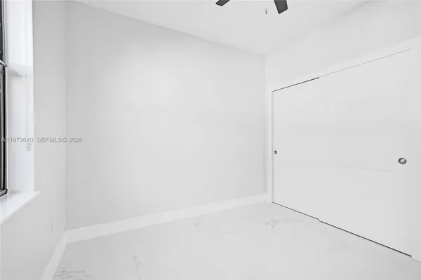 a view of an empty room with window