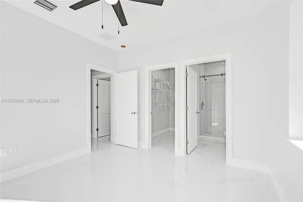 an aerial view of a house with a ocean view