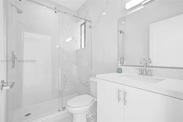 an aerial view of a house with a garden