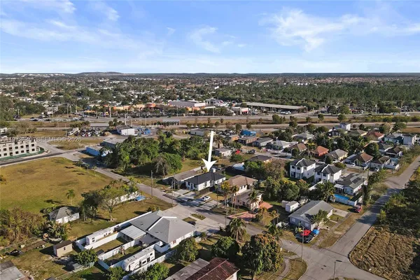 an aerial view of residential building with trees