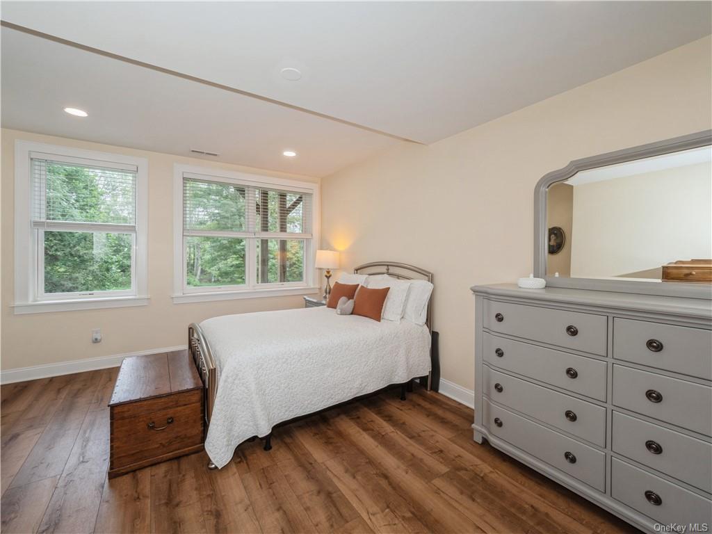 6-8 Wilbur Road Pleasant Valley, NY 12569 - Photo 13 of 36 Bedroom featuring dark wood-type flooring and multiple windows