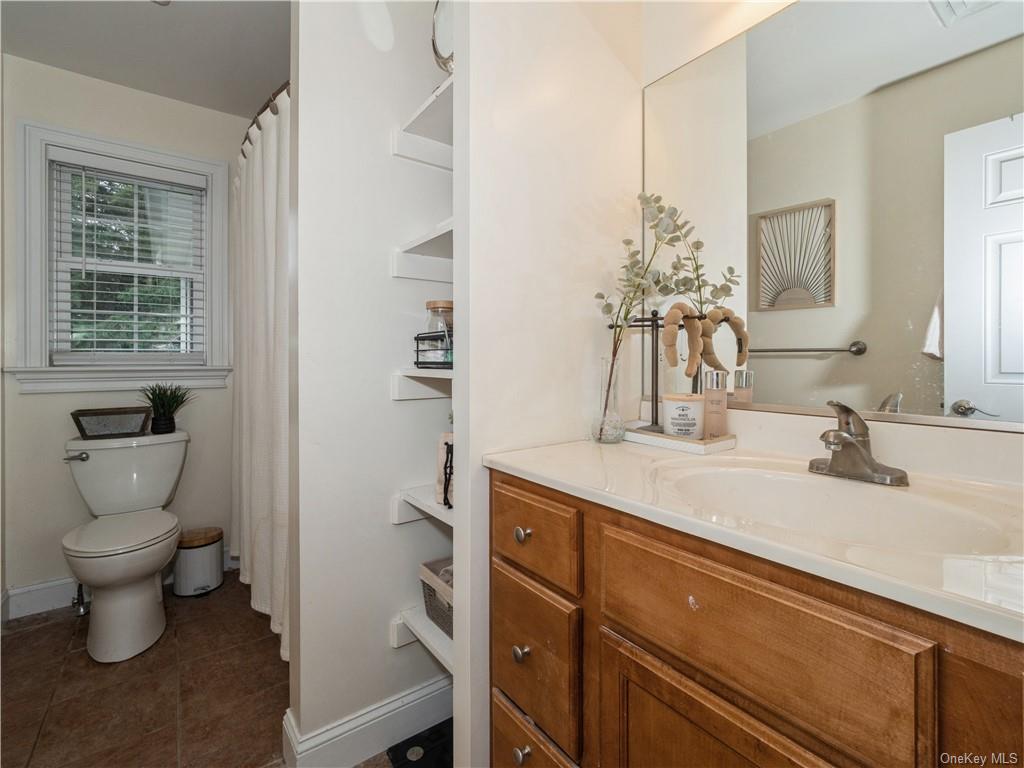 6-8 Wilbur Road Pleasant Valley, NY 12569 - Photo 18 of 36 Bathroom featuring vanity, tile patterned flooring, and toilet