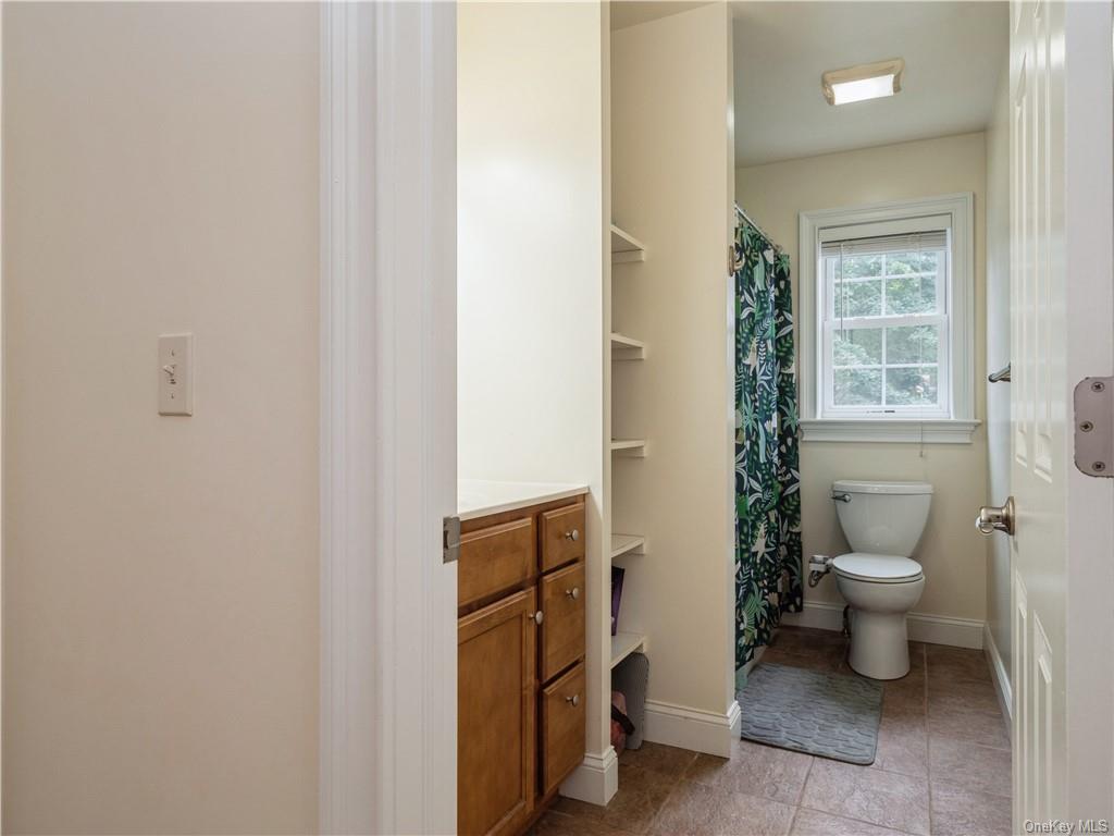 6-8 Wilbur Road Pleasant Valley, NY 12569 - Photo 30 of 36 Bathroom featuring toilet, tile patterned floors, and vanity