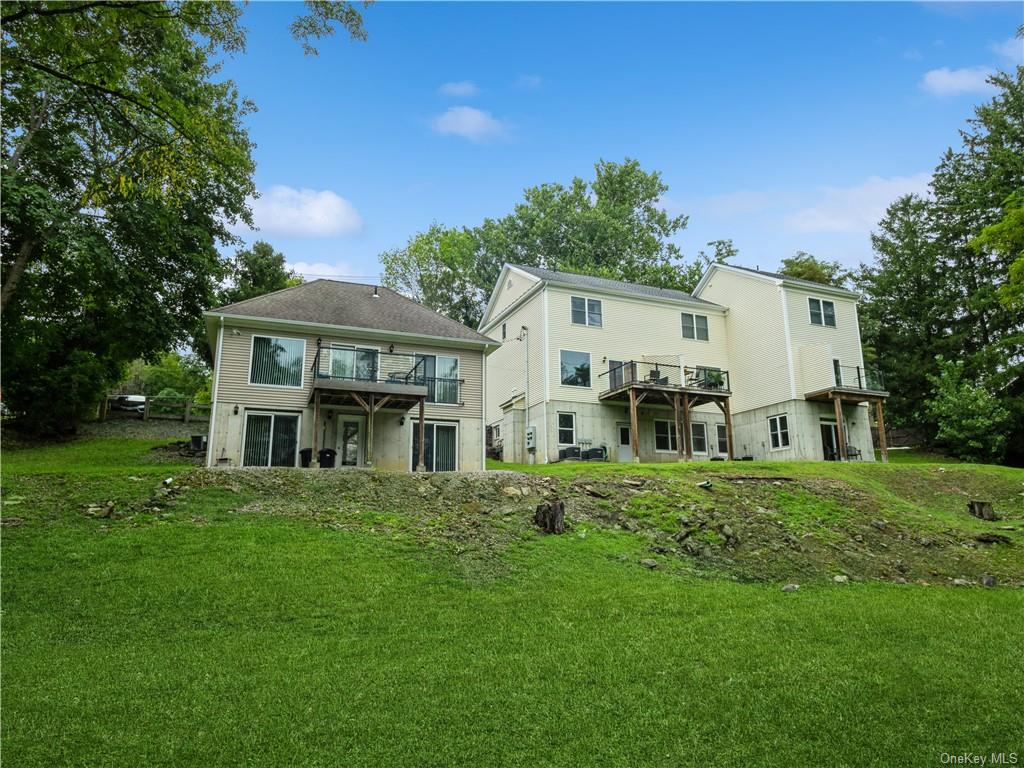 6-8 Wilbur Road Pleasant Valley, NY 12569 - Photo 3 of 36 Back of property with a balcony and a yard