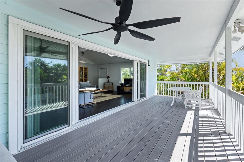315 Spring Avenue Anna Maria, FL 34216 - Photo 22 of 63 a view of a balcony with wooden floor