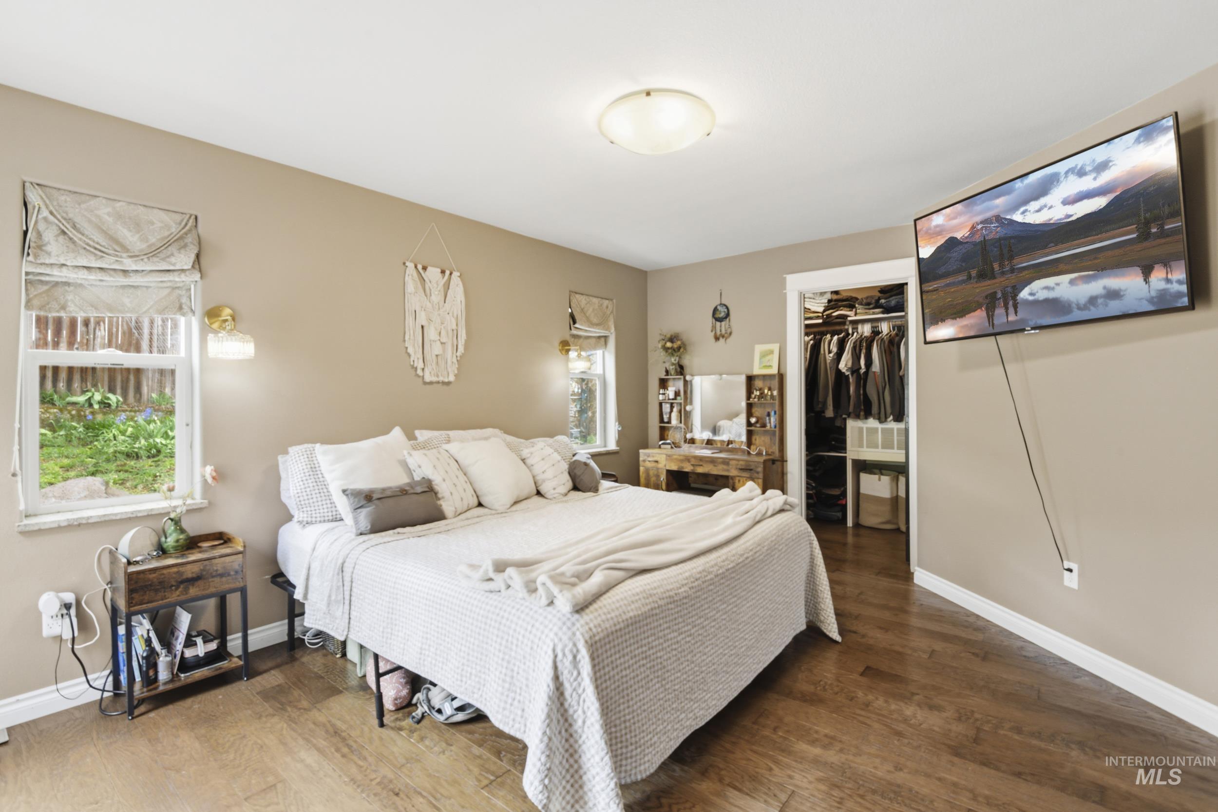 301 State Street Juliaetta, ID 83535 - Photo 21 of 41 Bedroom with a walk in closet and wood finished floors