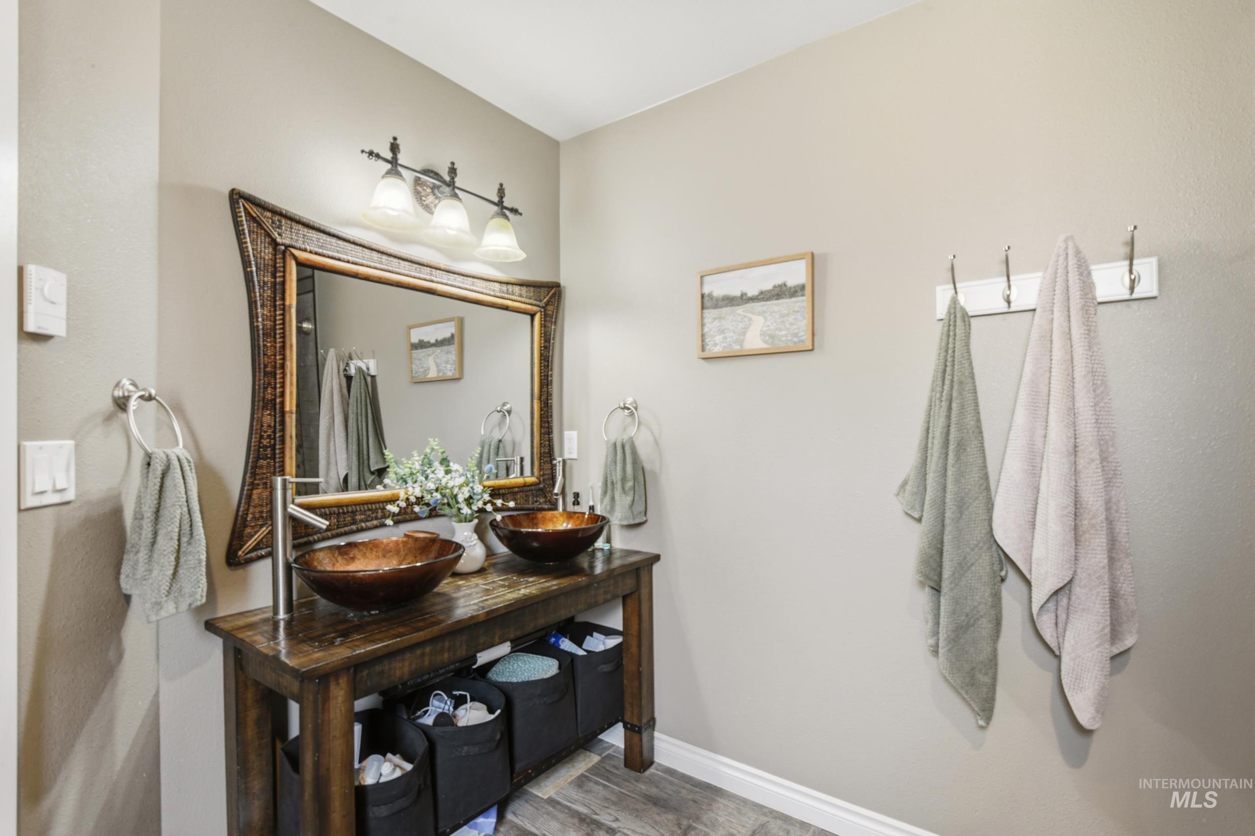 301 State Street Juliaetta, ID 83535 - Photo 24 of 41 Full bath featuring double vanity and light wood-type flooring