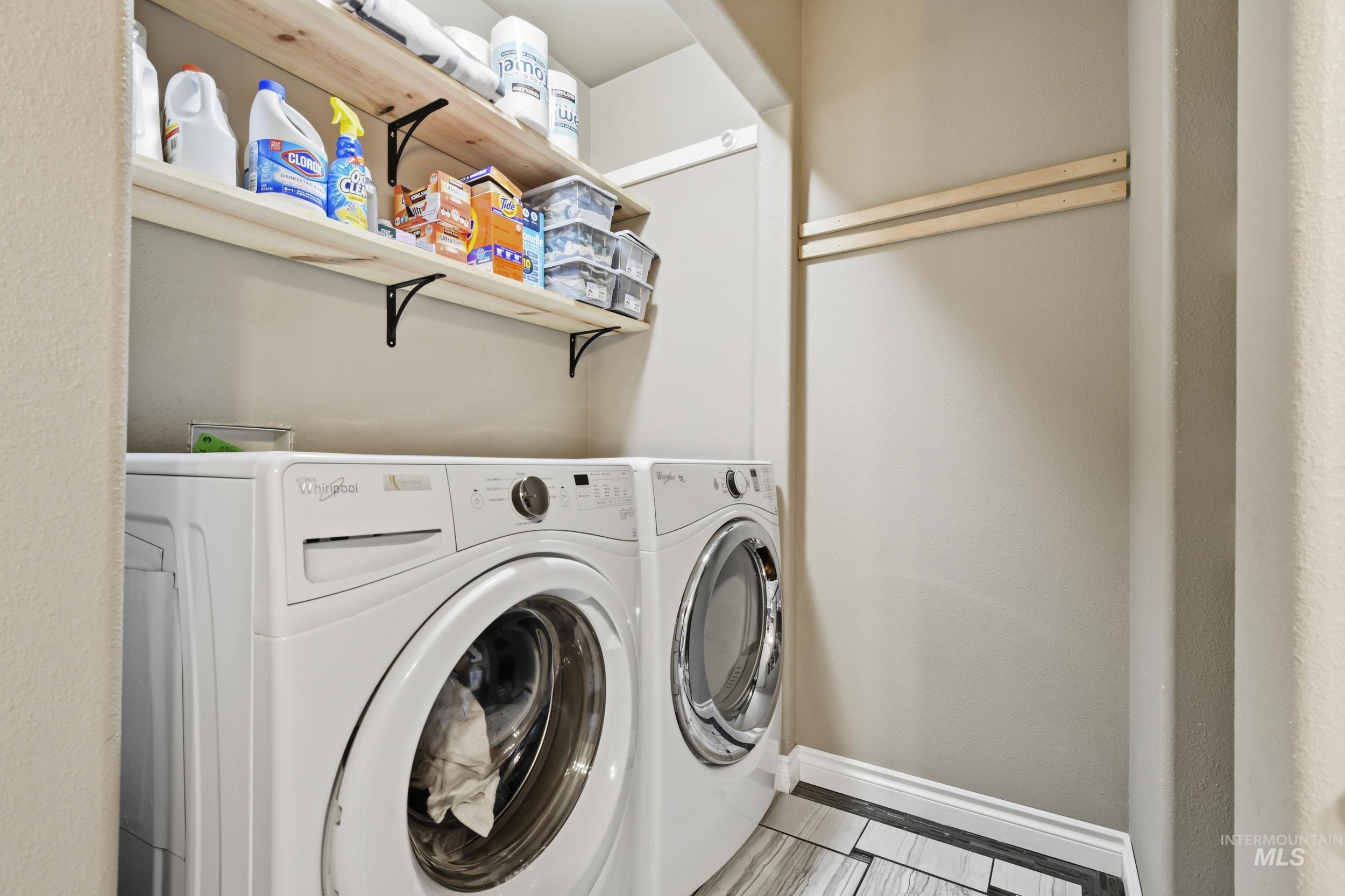 301 State Street Juliaetta, ID 83535 - Photo 31 of 41 Laundry area with baseboards and washing machine and dryer