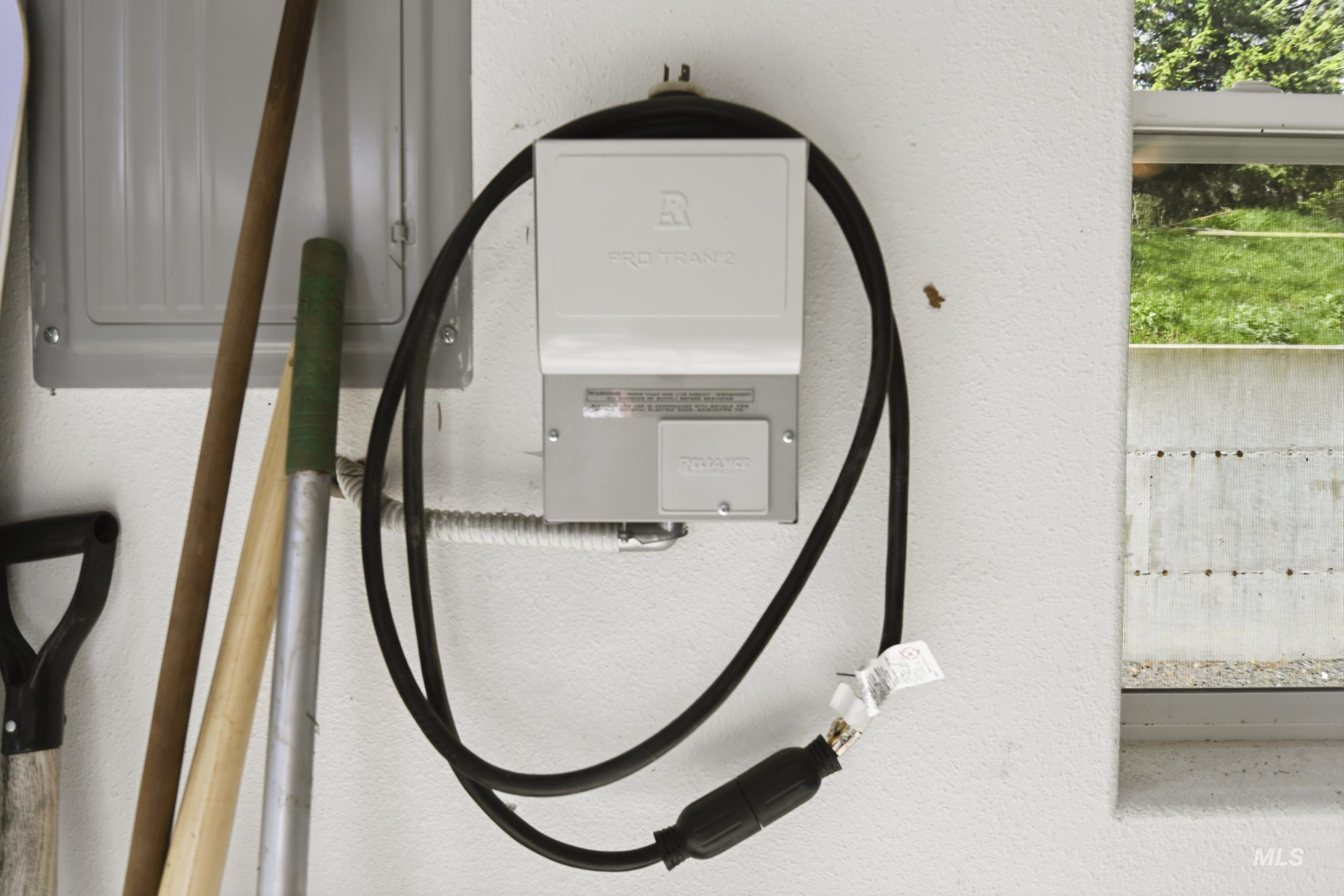 301 State Street Juliaetta, ID 83535 - Photo 33 of 41 Garage view of electric vehicle charger and stucco siding