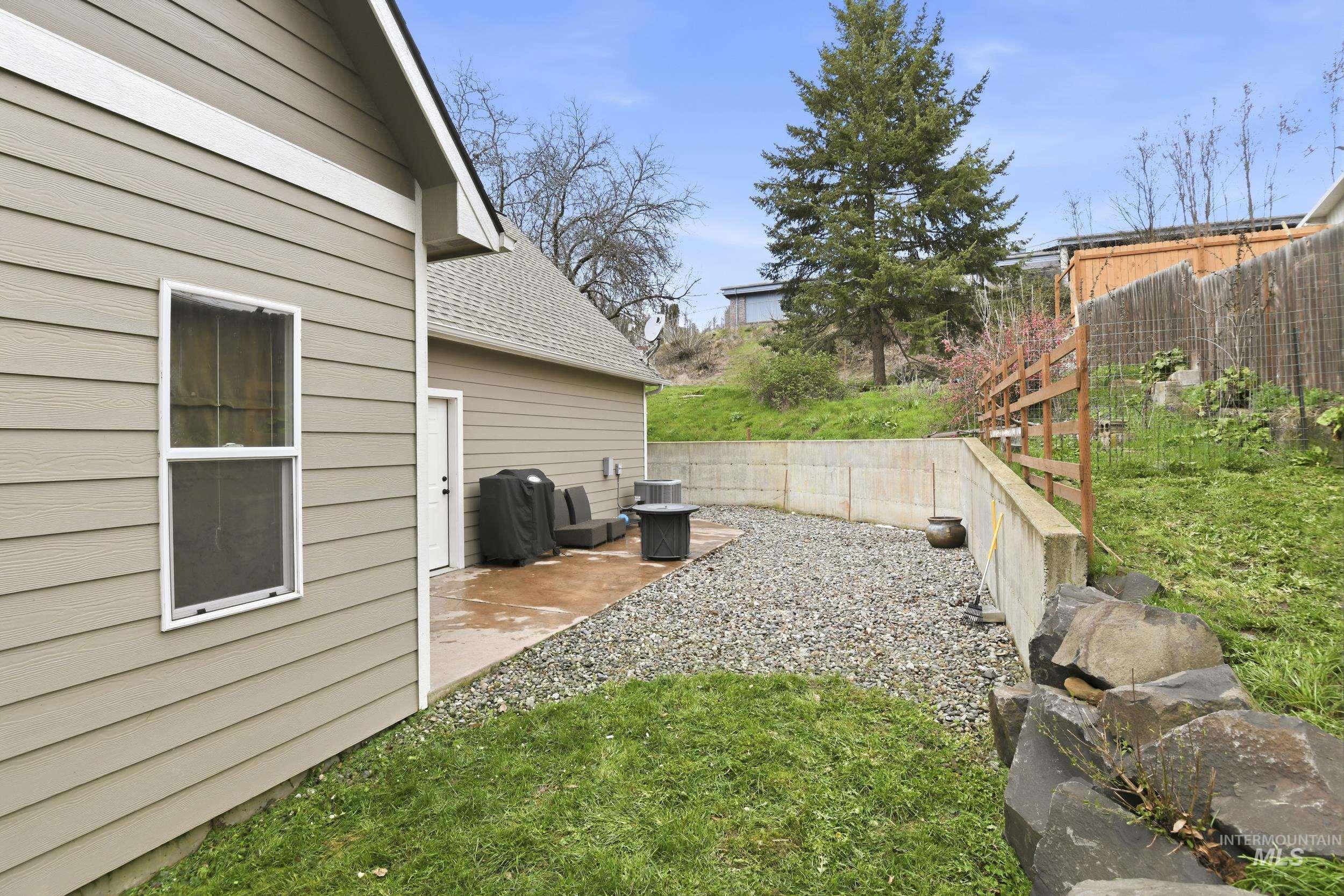 301 State Street Juliaetta, ID 83535 - Photo 38 of 41 Fenced yard with a patio area