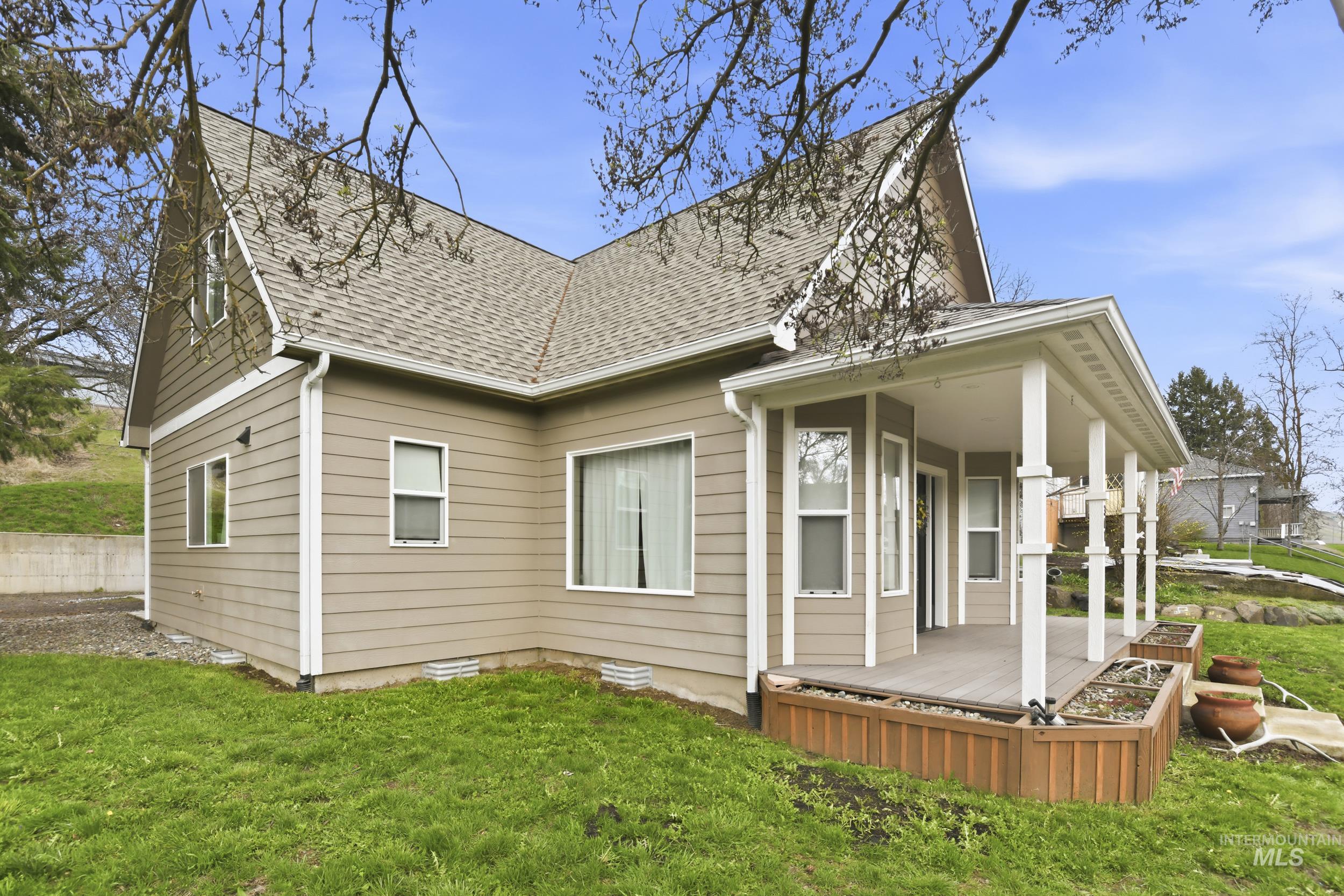 301 State Street Juliaetta, ID 83535 - Photo 4 of 41 View of property exterior with roof with shingles and a lawn