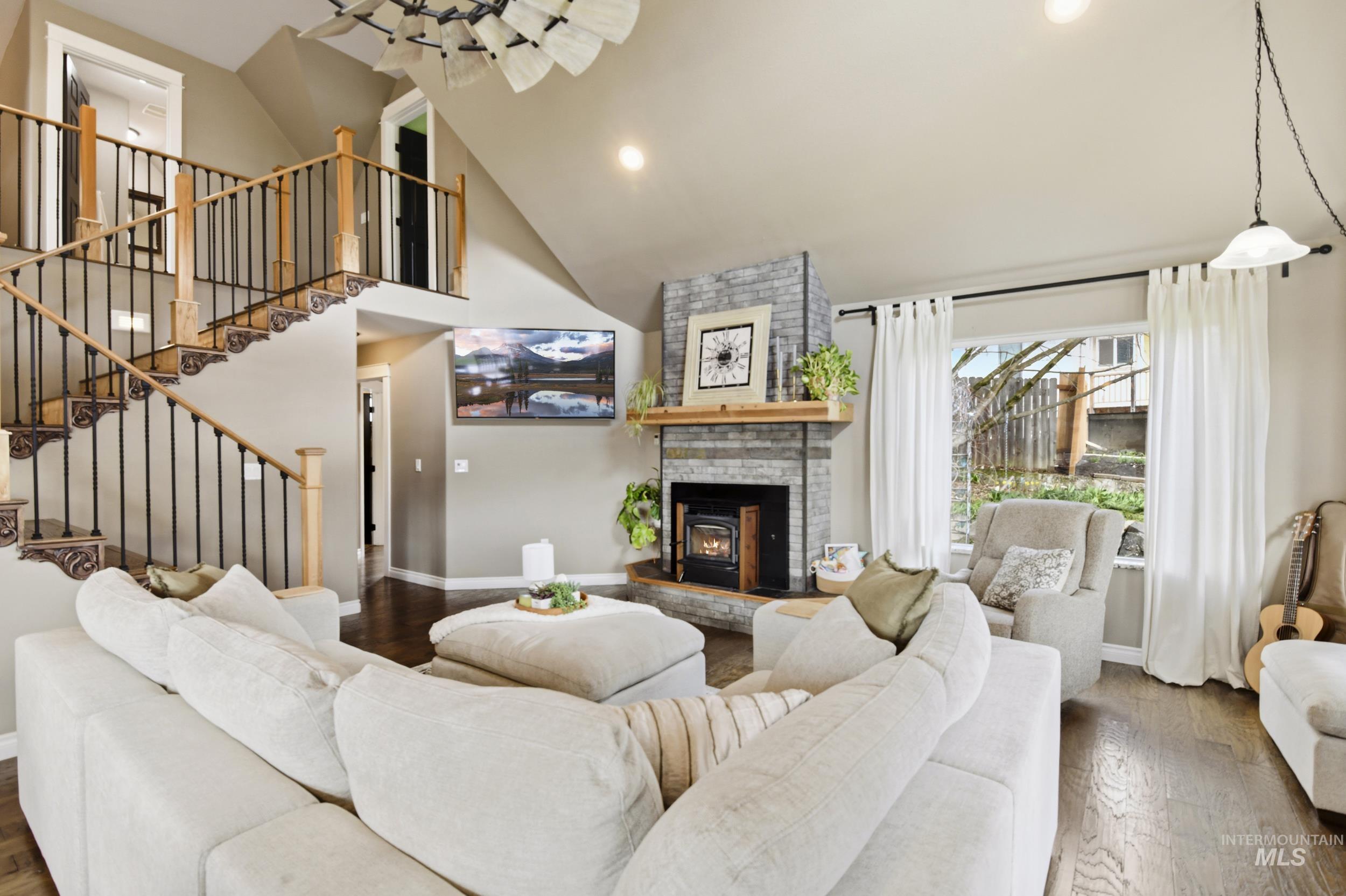 301 State Street Juliaetta, ID 83535 - Photo 9 of 41 Living area with wood-type flooring, lofted ceiling, and recessed lighting