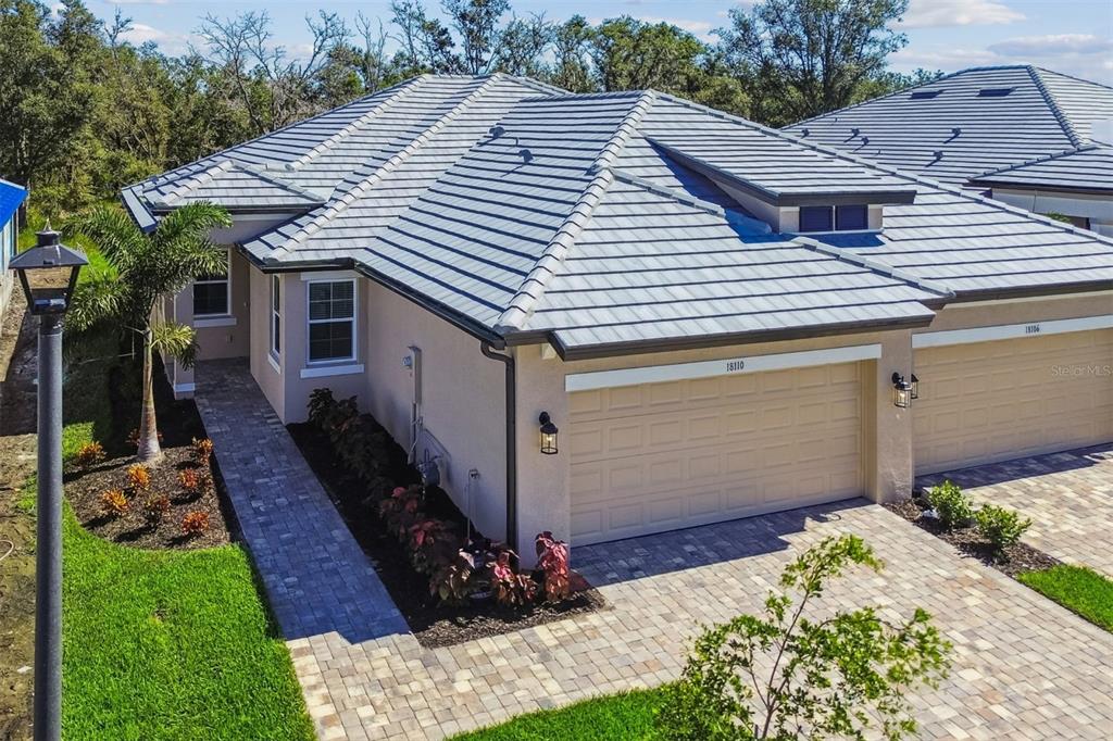 18110 Cherished Loop Lakewood Ranch, FL 34211 - Photo 1 of 1 a front view of a house with a yard