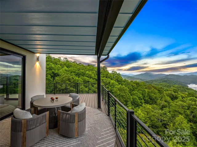 a view of a balcony with chairs