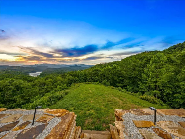 a swimming pool view with a outdoor seating