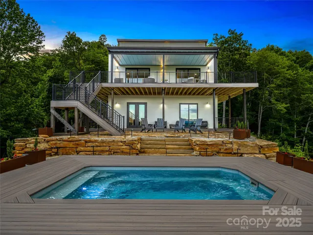 an aerial view of a house with a big yard