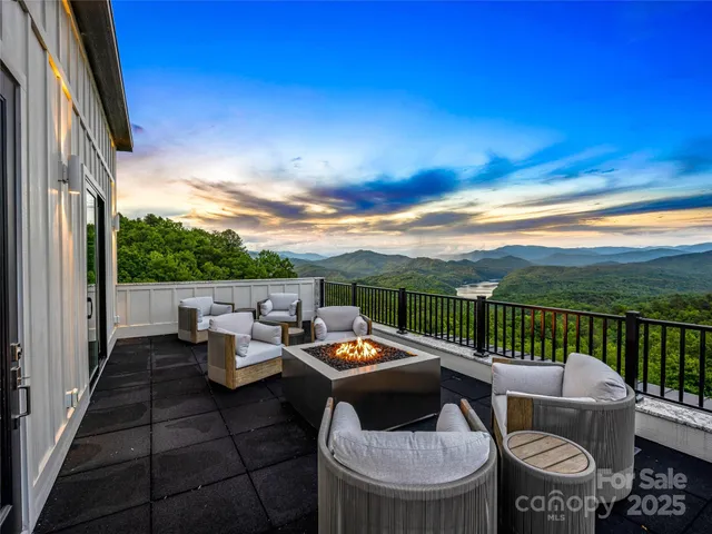 a view of a house with pool and chairs