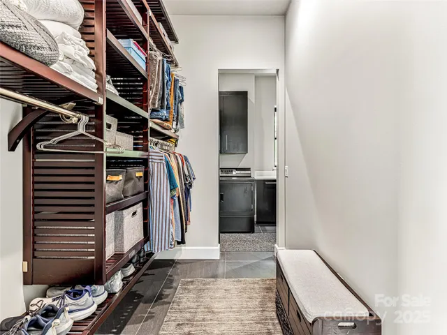 a kitchen with stainless steel appliances granite countertop a sink and a stove top oven