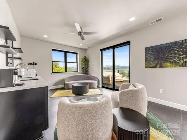 a living room with furniture and a window