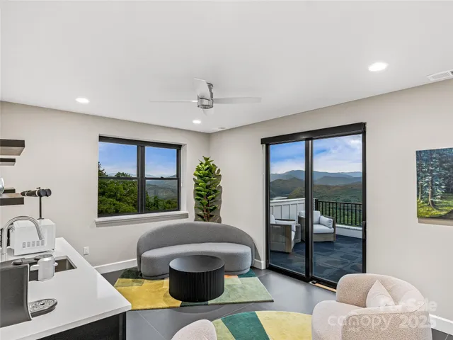 a bed sitting in a room next to a window