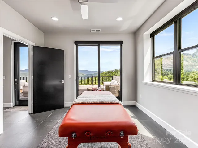 a bedroom with a bed and a couch