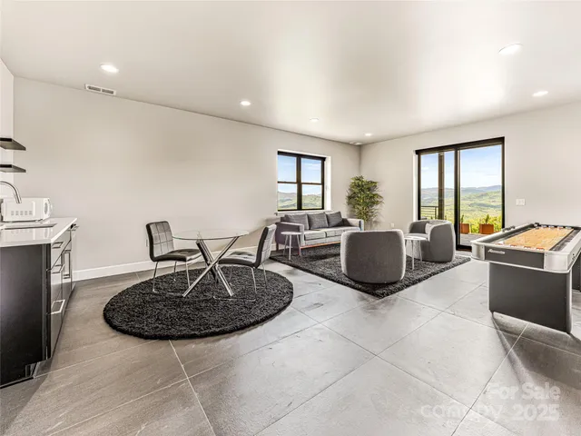 a living room with furniture and a rug