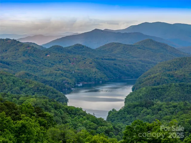 a view of a garden with a building in the background