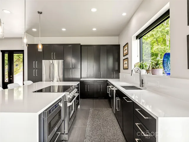 a kitchen with a sink stove and cabinets